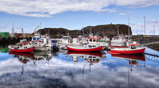 In the red. Fishing boats ready for launch. Johnny Peacock/Flickr, CC BY-NC-ND