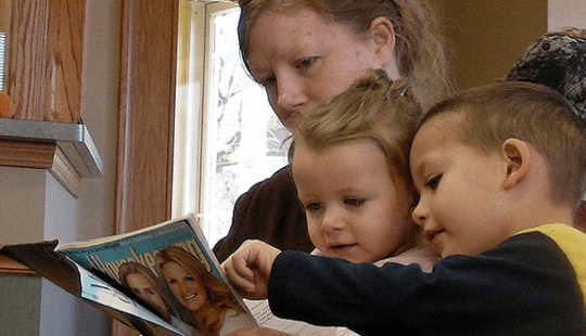 Mother reads with children. Diana Ramsey, CC BY