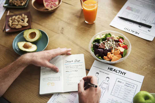 A man fills out a diet plan