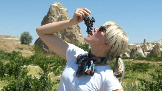 woman eating grapes