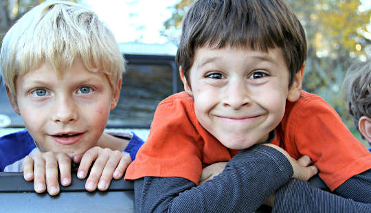 two young boys with passionate expressions