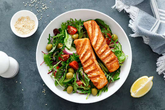 a plate of healthy food - vegetables and fish