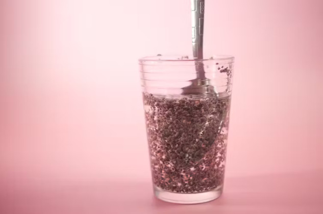 A glass of chia seed water with lemon slices, resembling the appearance of "tadpole water," highlighting its health benefits.