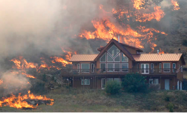 A house surrounded by defensible space that protected it from a nearby wildfire.