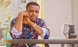 photo of a confident black man sitting at a table