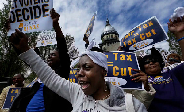 Protesters outside Illinois Capitol advocating for changes in state tax policies