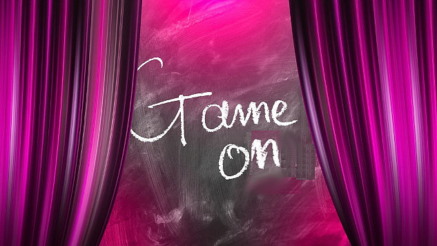 open curtains on a stage with the words "Game On" written in the opening