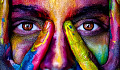 a face covered with various bright and vibrant colors