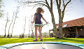 young girl jumping on a trampoline