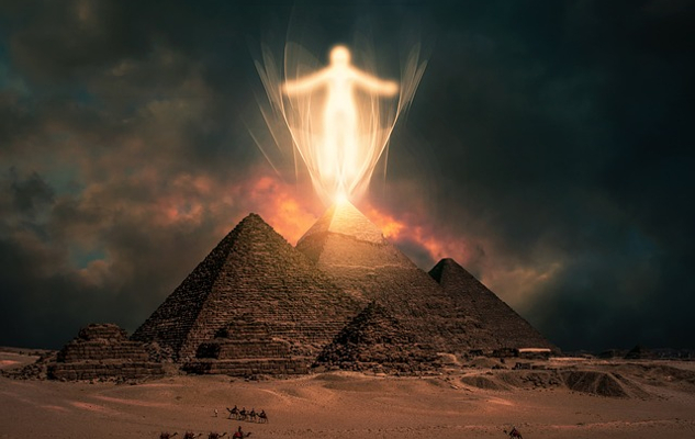 a ghostly figure above the pyramids