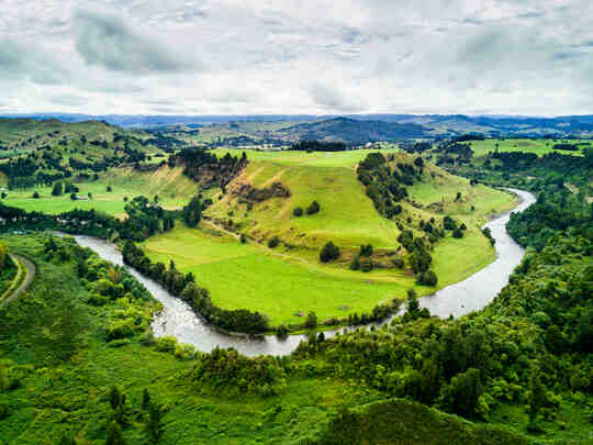 A river winding through lush green valley