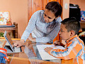 A family learning together at home, representing the rising trend in home education and the benefits it offers for personalized, flexible learning.