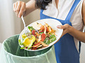 Image of fresh vegetables in a kitchen, illustrating tips for reducing food waste at home by planning meals and using leftovers effectively.