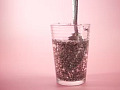 A glass of chia seed water with lemon slices, resembling the appearance of "tadpole water," highlighting its health benefits.