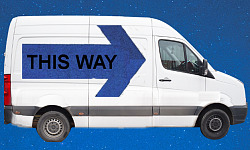 a white van with a huge sign on its side: This Way
