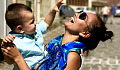 laughing mother holding her baby