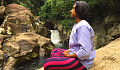 a young man meditation outside